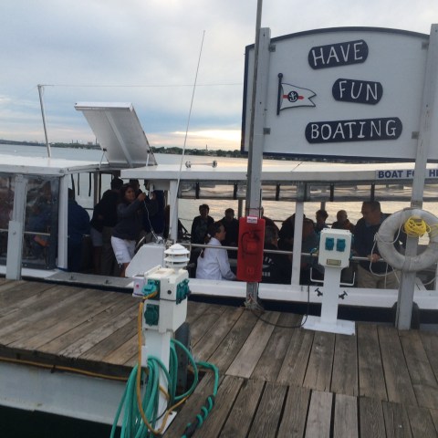 a group of people standing around a plane