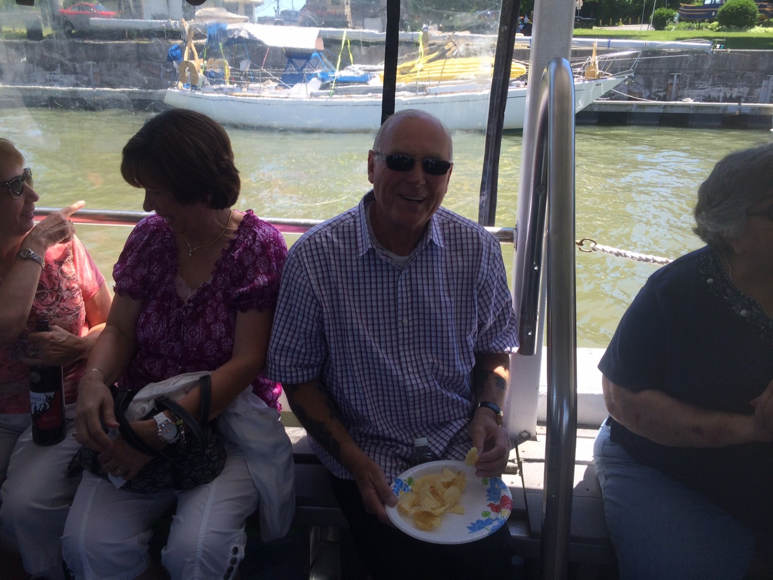a group of people sitting at a dock