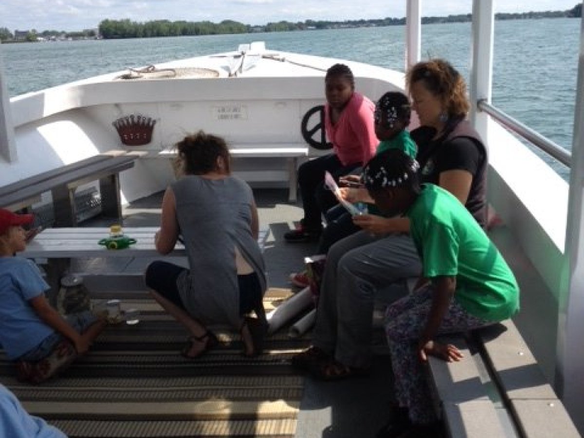 a group of people sitting at a train station
