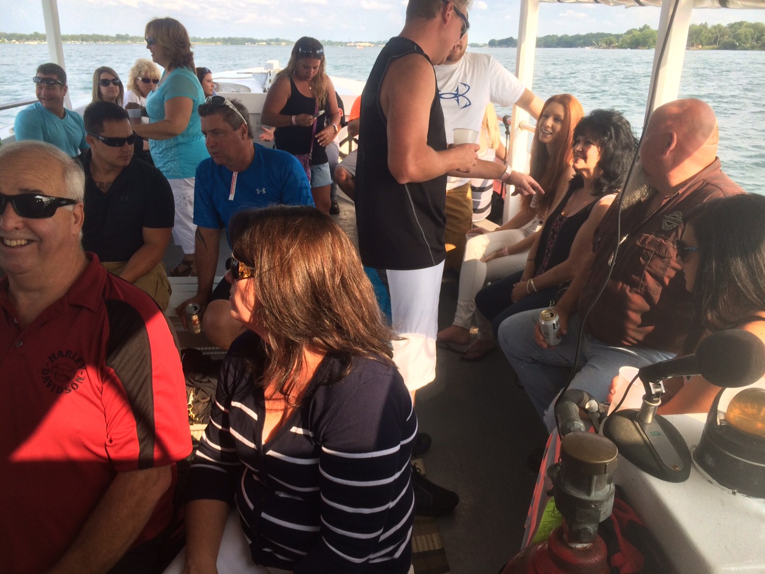 a group of people are drinking from the water