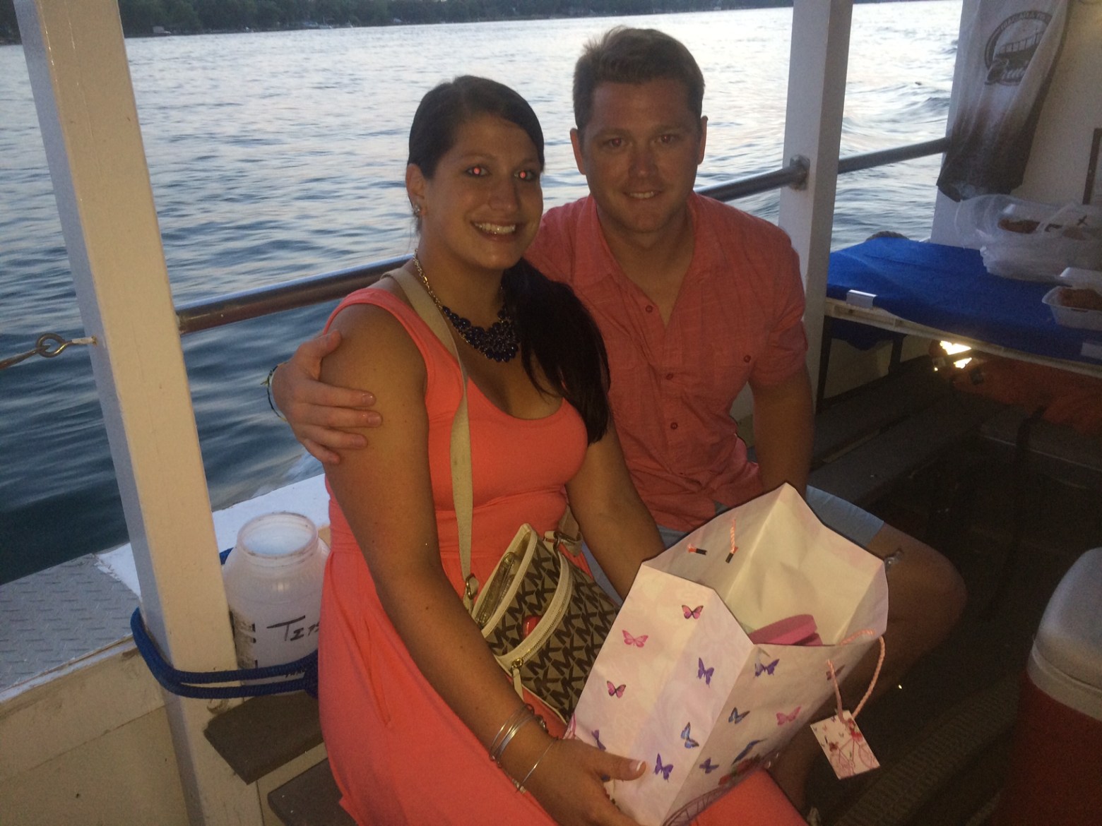 Bob Meyer et al. sitting in front of water