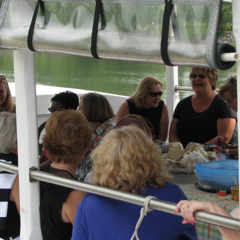 a group of people sitting in front of a window