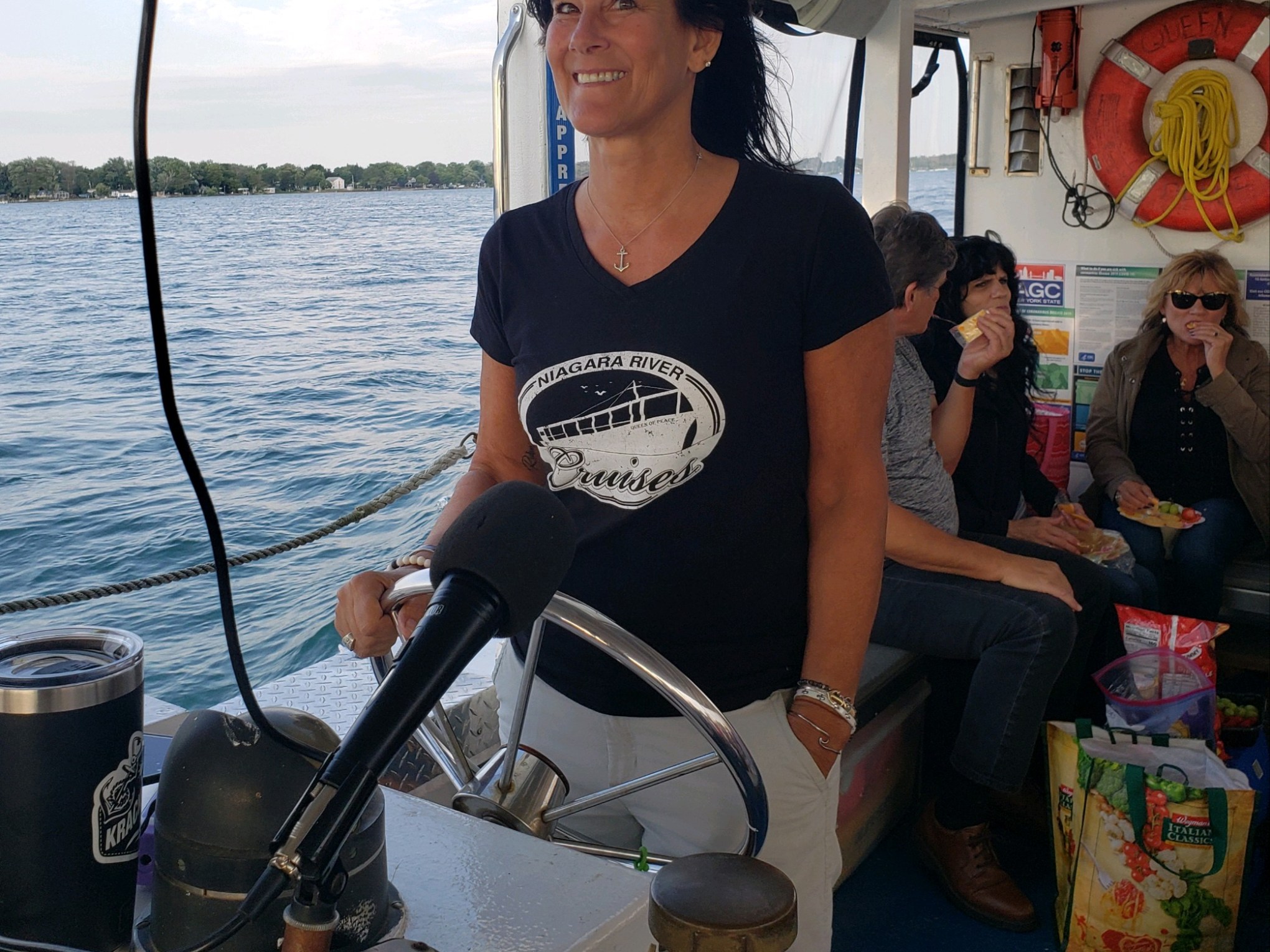 a person standing on a boat in the water
