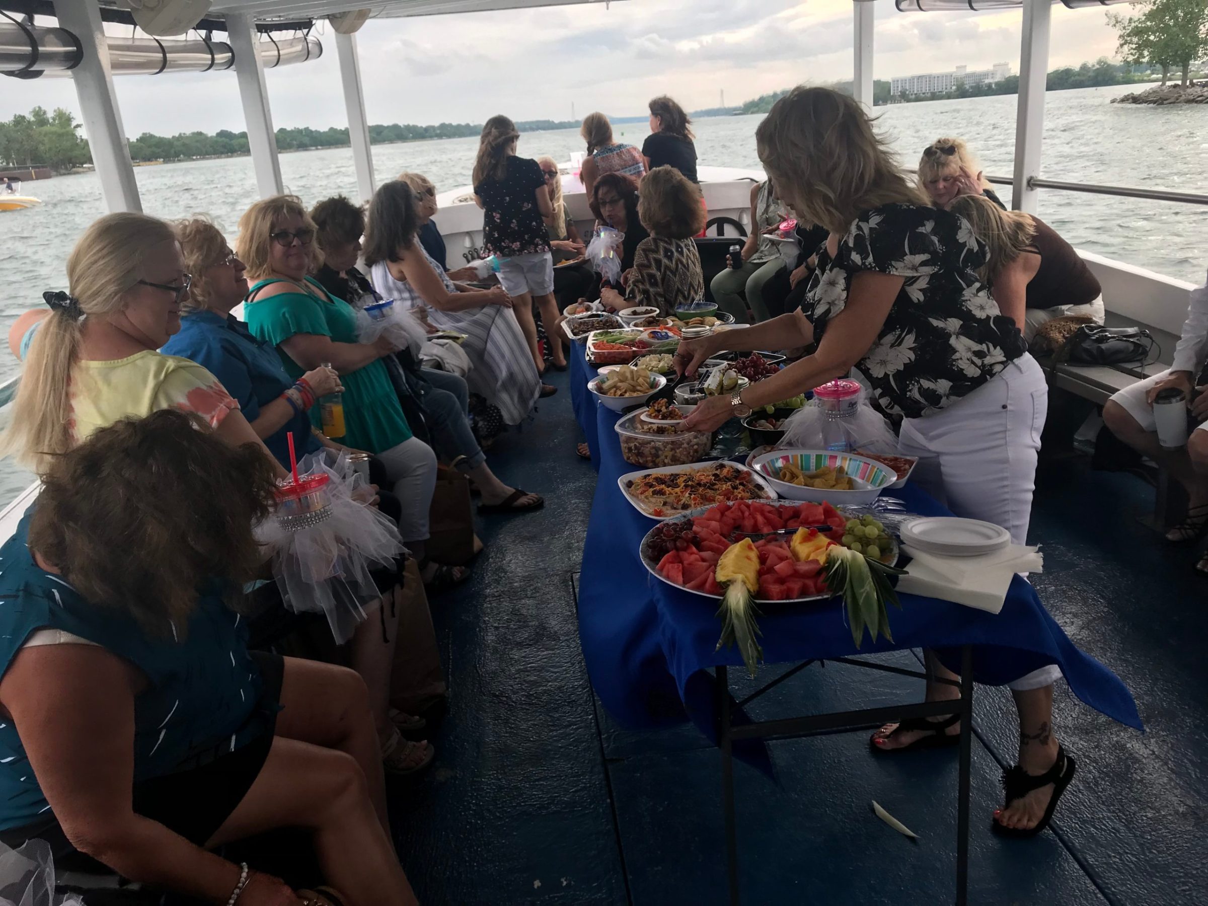 a group of people sitting at a picnic table