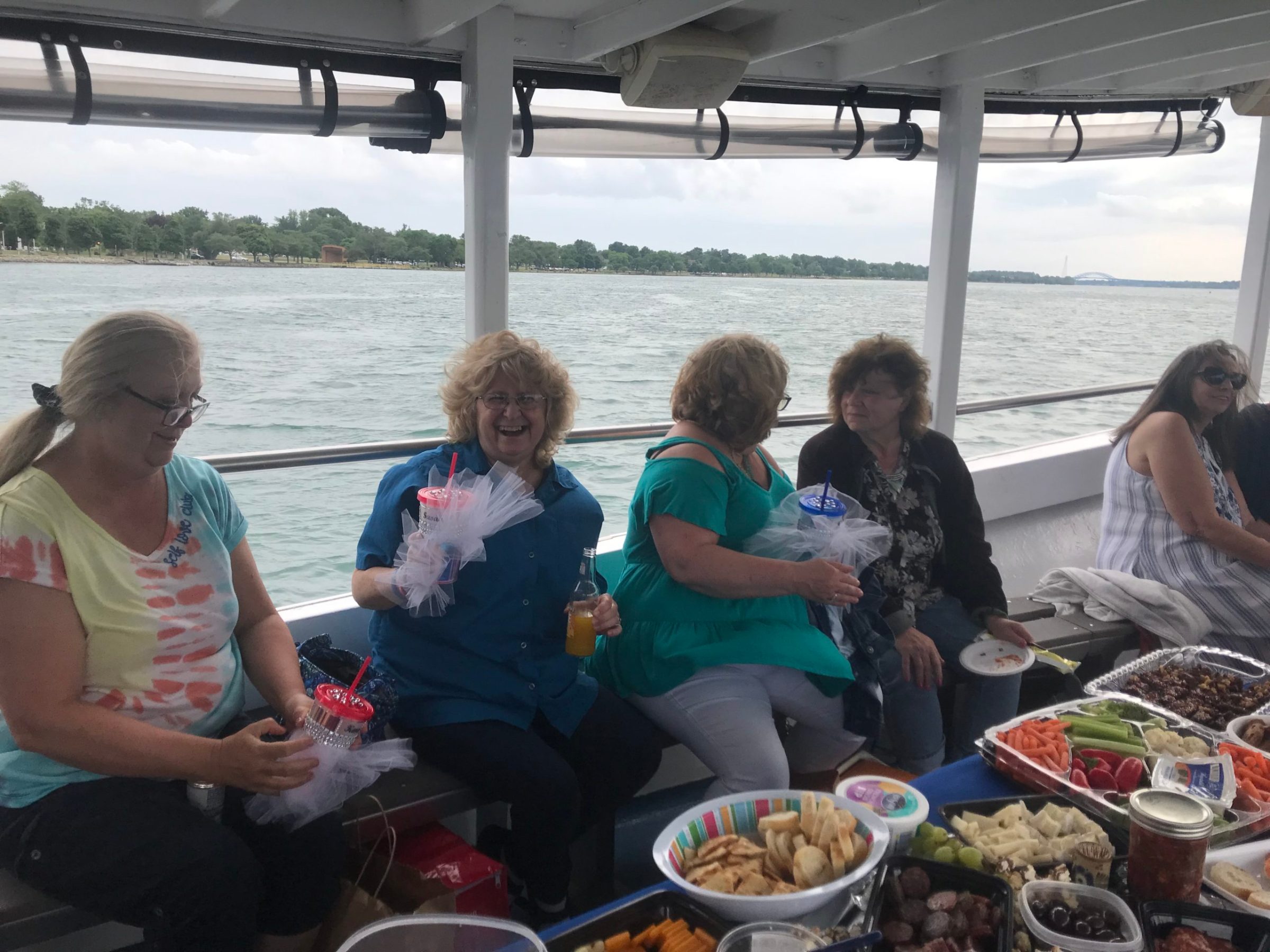 a group of people sitting at a picnic table