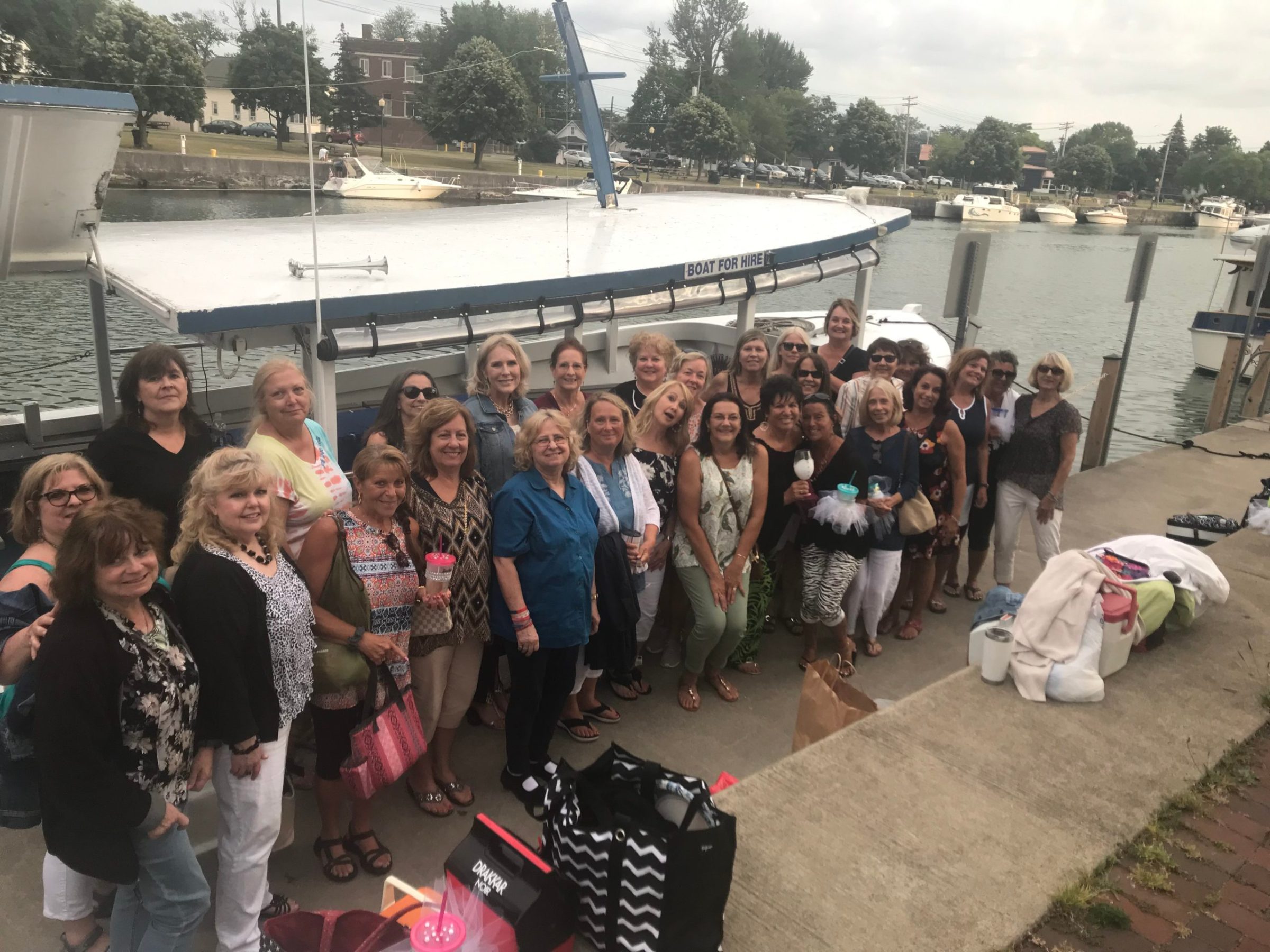 a group of people standing in front of a crowd posing for the camera