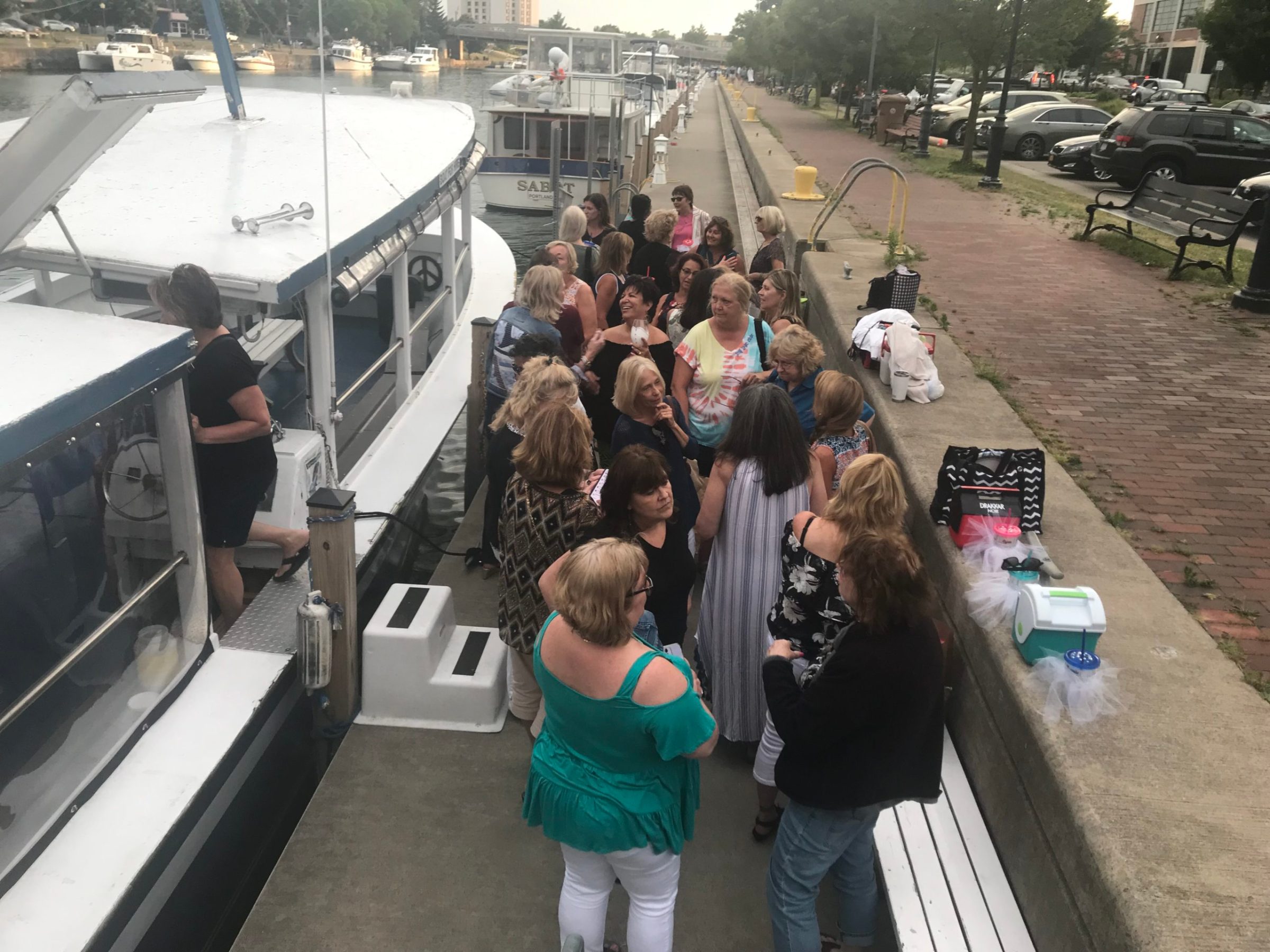 a group of people standing next to a train