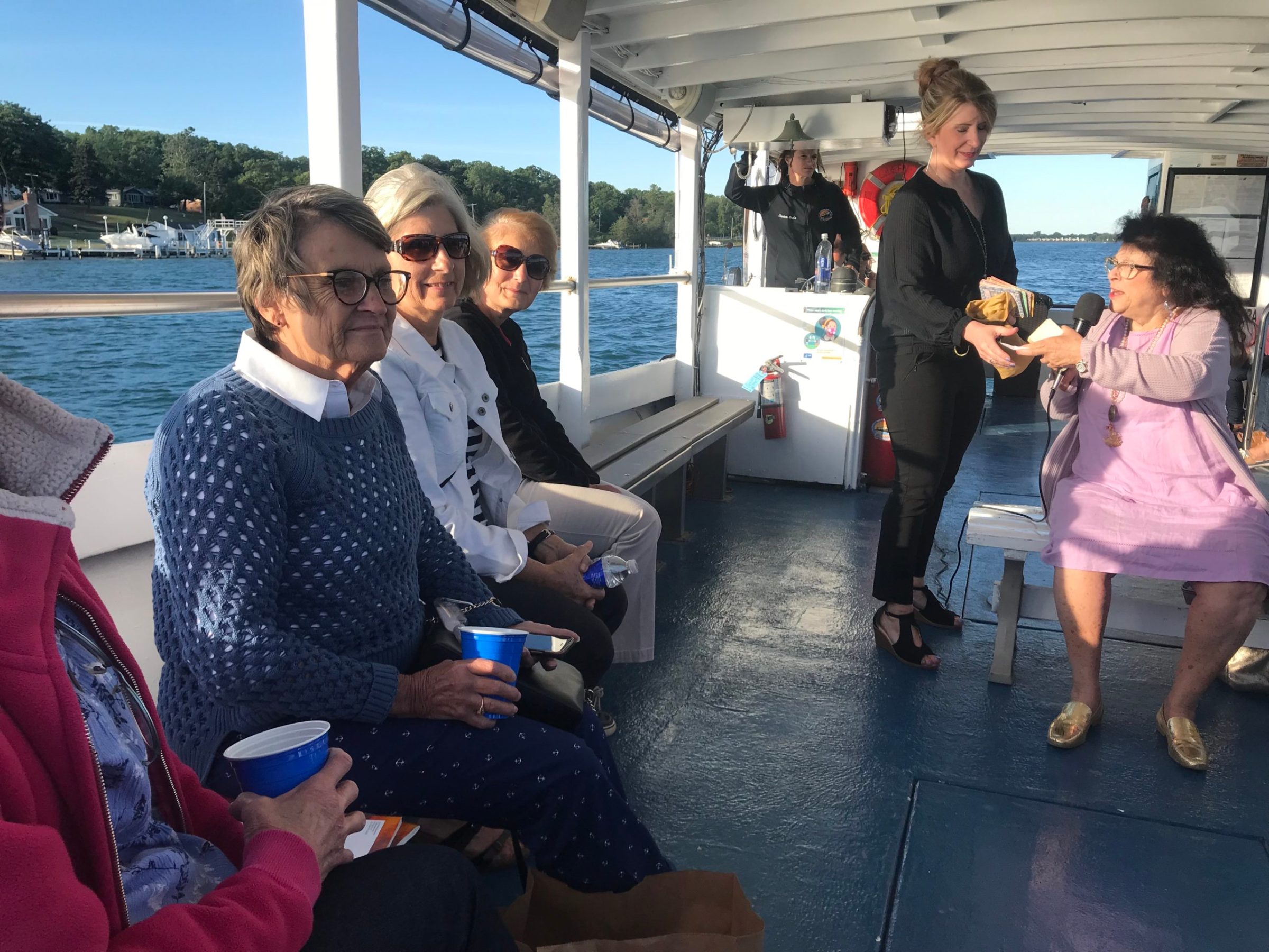 a group of people sitting at a train station