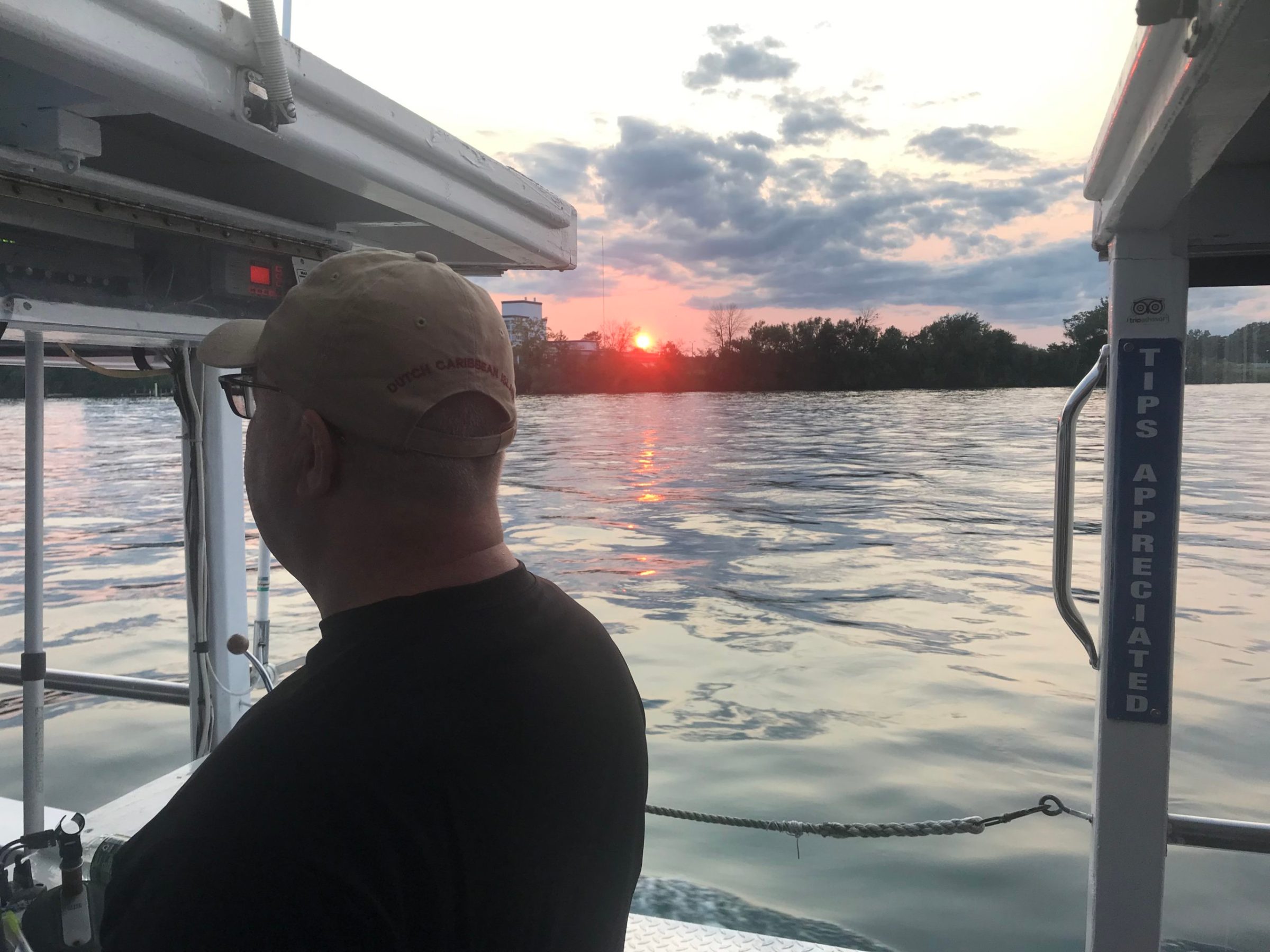 a man standing in front of a boat