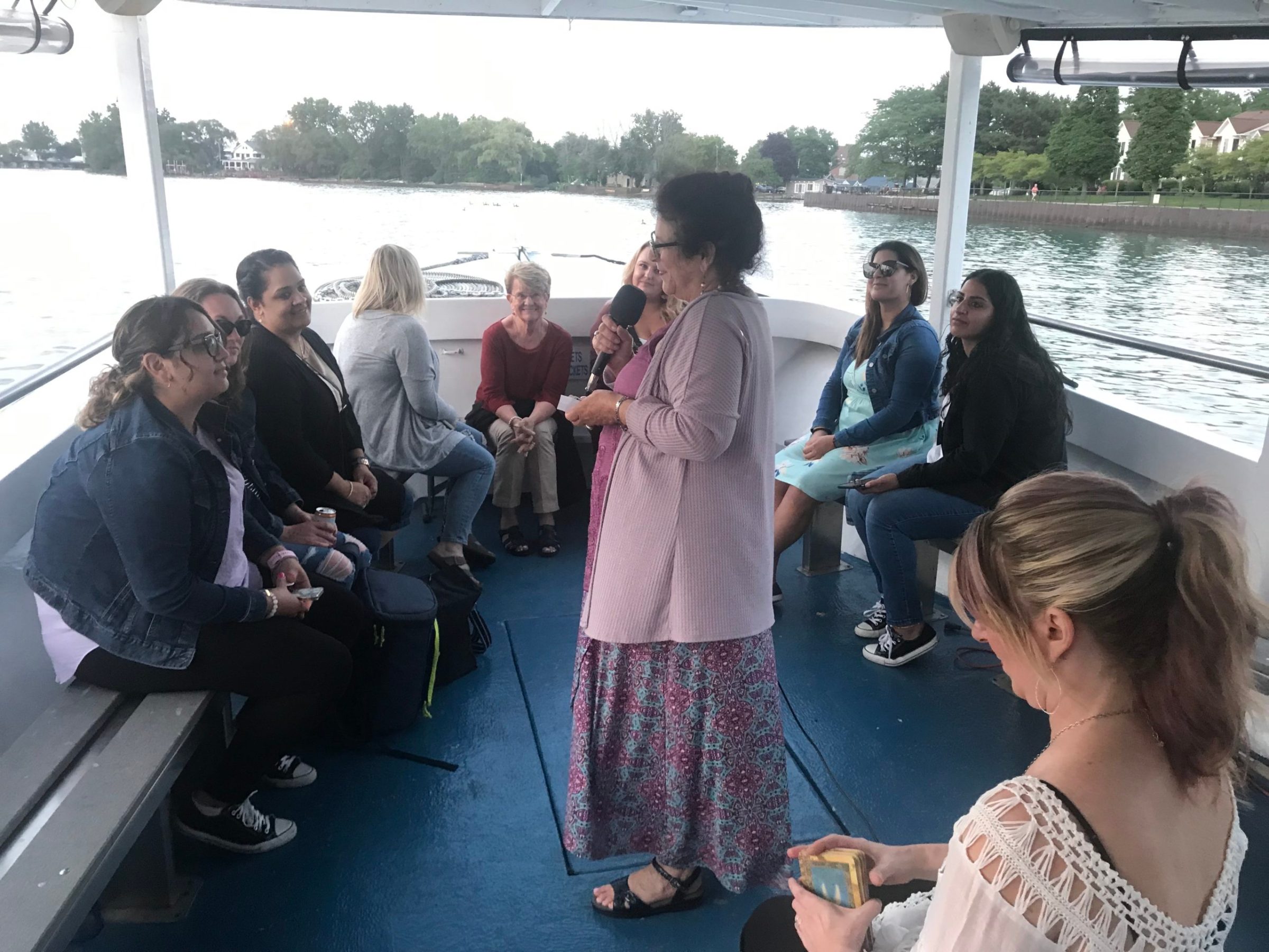 a group of people standing next to a woman