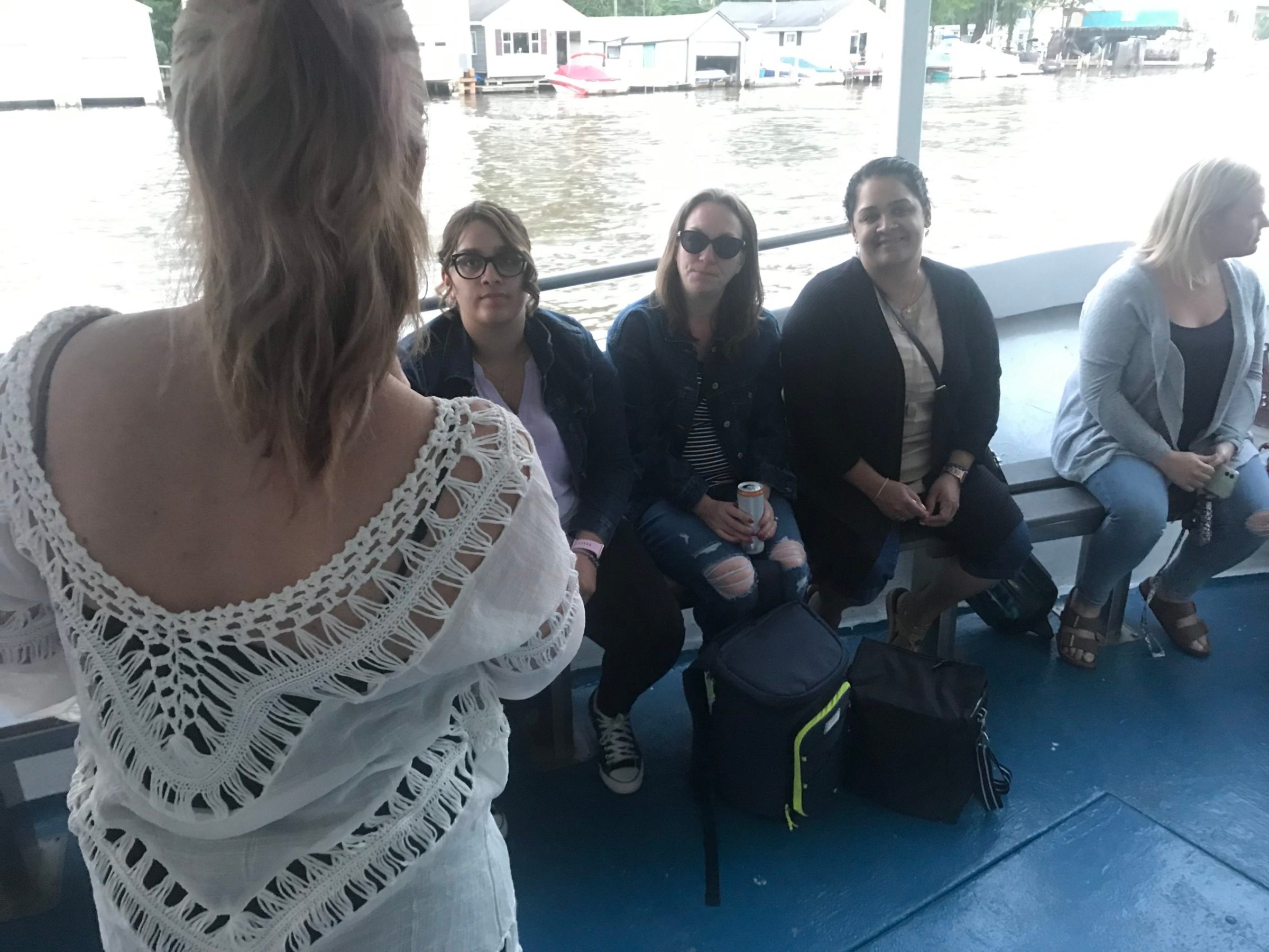 a group of people standing next to a woman