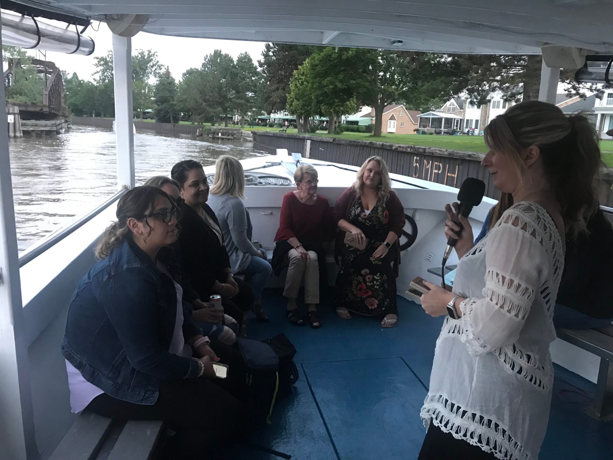 a group of people standing next to a river